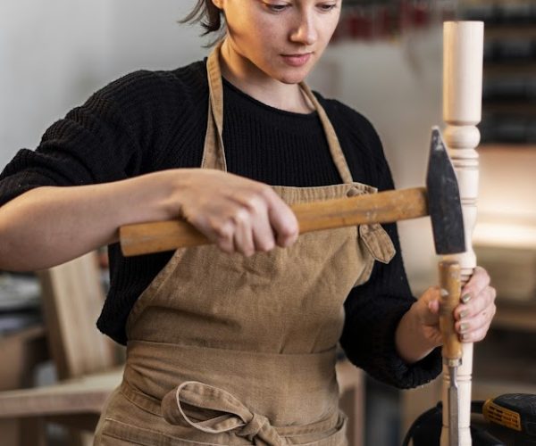 young-female-working-wood-engraving-workshop copy